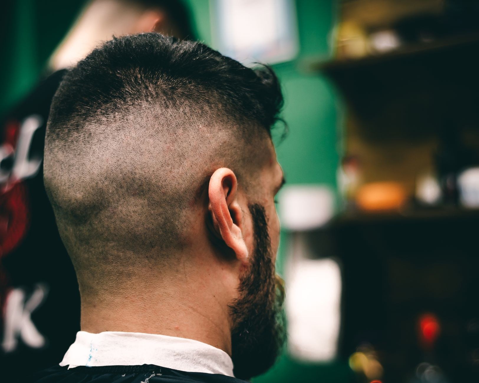 Sharp faded sides on a bearded client